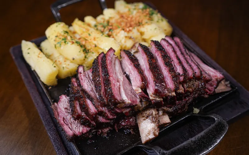 Sliced slow roasted beef served on a skillet