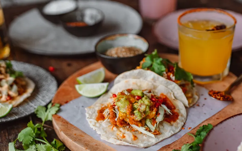 Beef and chicken tacos with salsa and lime